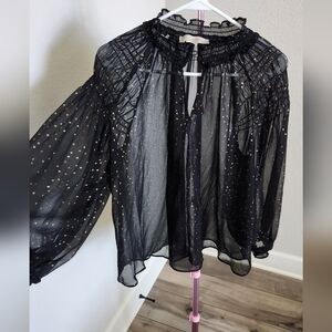 Black top with gold polka dots